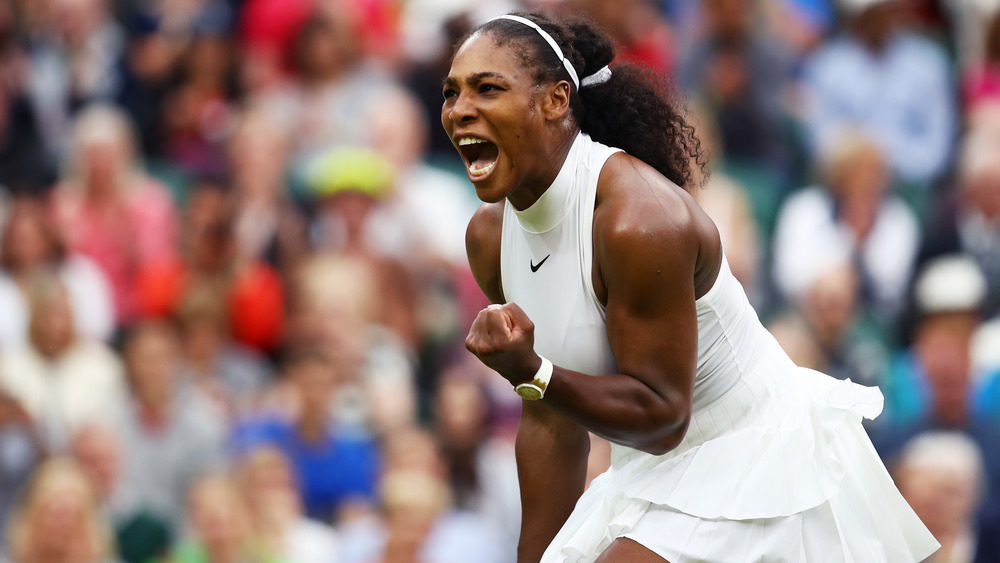 Serena Williams playing competitive tennis on the court