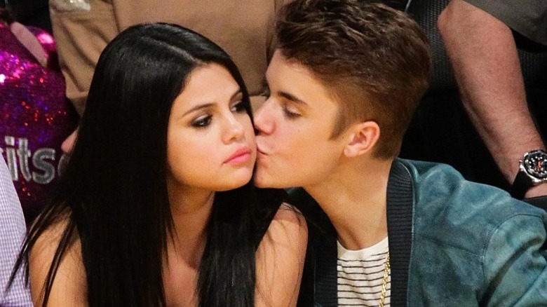 Justin Bieber kissing Selena Gomez on the cheek