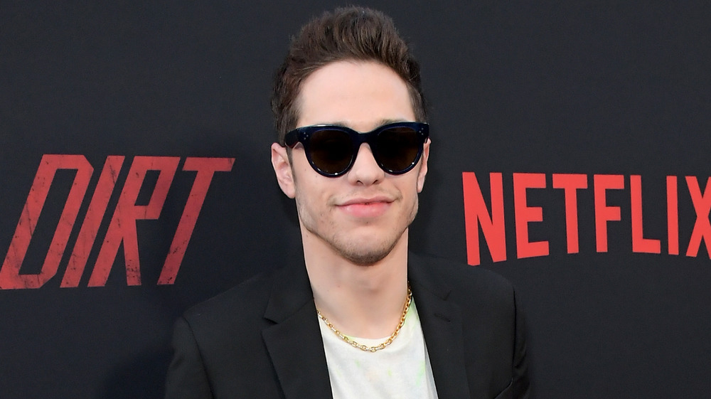 Pete Davidson wearing sunglasses on the red carpet 