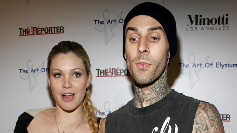 Travis Barker, Shanna Moakler posing