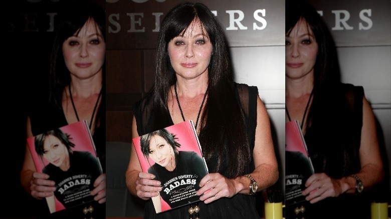 Shannen Doherty posing with her memoir