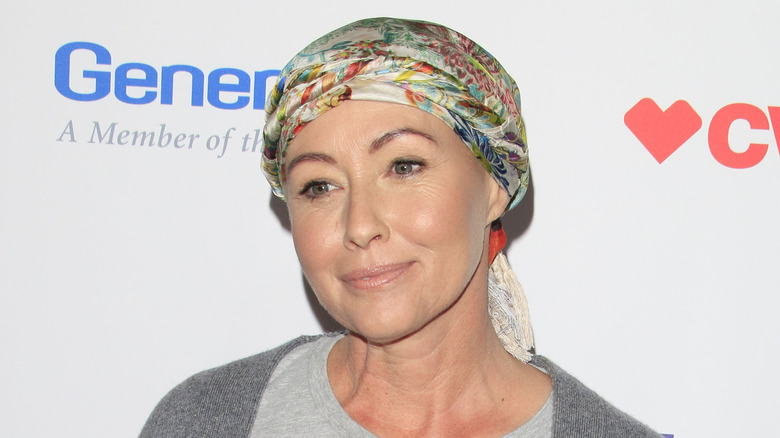 Shannen Doherty smiling in headscarf