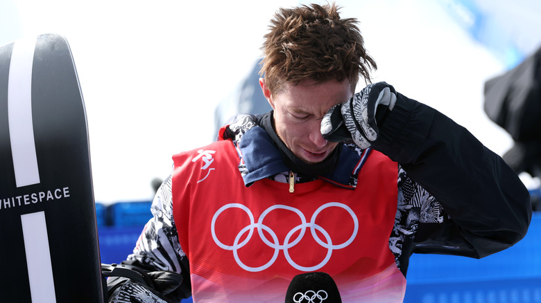 Shaun white wipes away tears during interview