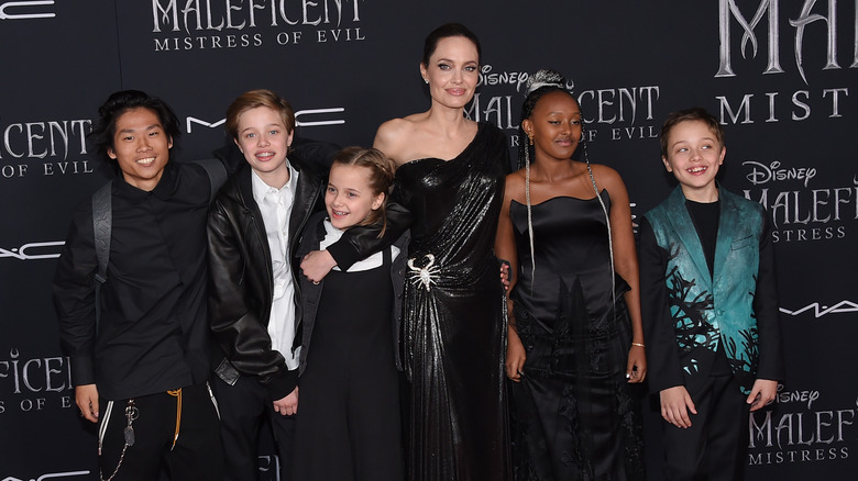 Angelina Jolie poses with five of her children