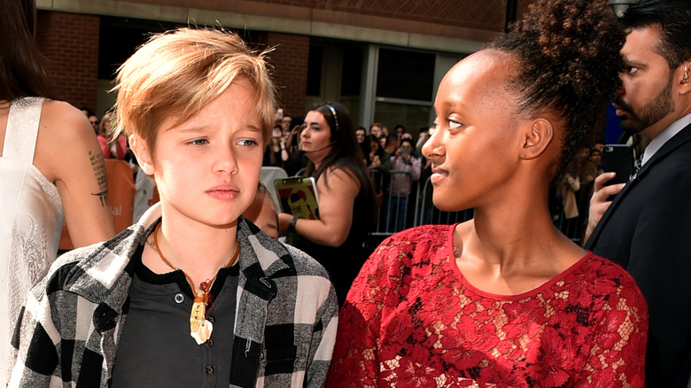 Shiloh Jolie-Pitt frowning, Zahara Jolie-Pitt in profile