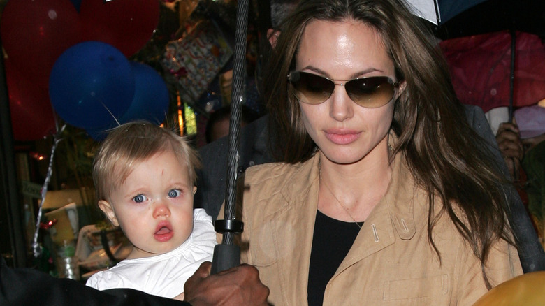 Angelina Jolie carrying Shiloh Jolie-Pitt