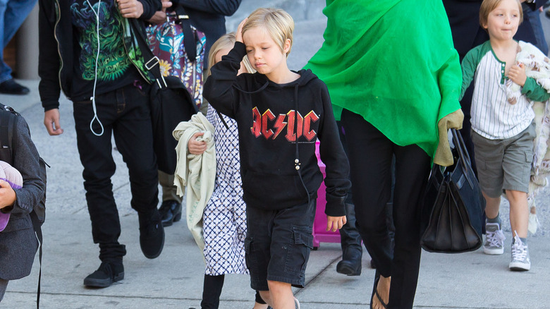 Shiloh Jolie-Pitt with hand on head