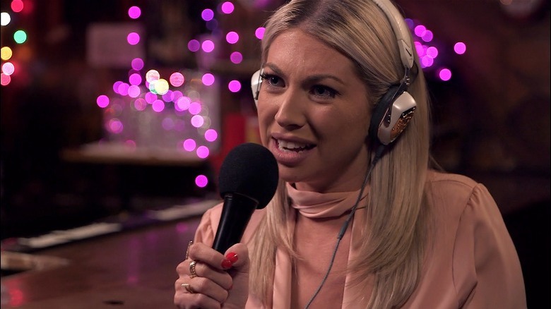 Stassi Schroeder speaking into microphone