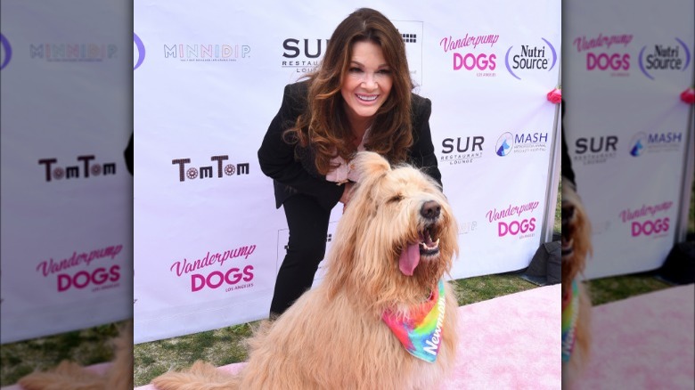 Lisa Vanderpump and dog, posing on red carpet