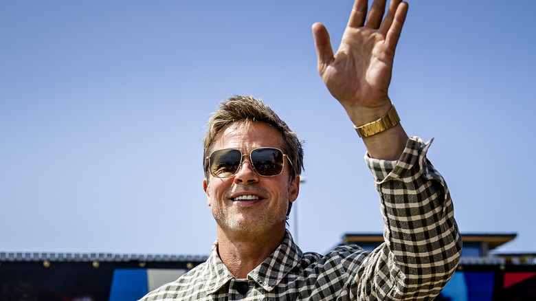 Brad Pitt waving to fans