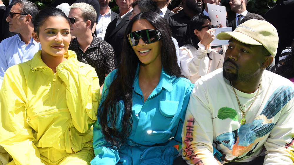 Kylie Jenner, Kim Kardashian, and Kanye West front row at a fashion show