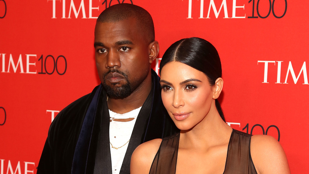 Kanye West and Kim Kardashian glaring on the red carpet at the Time 100 Gala 