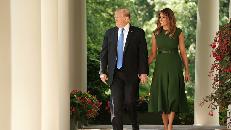 Donald and Melania Trump walking