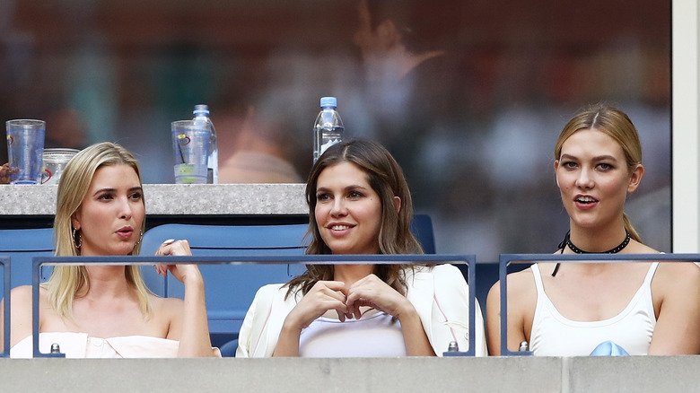 Karlie Kloss and Ivanka Trump sitting