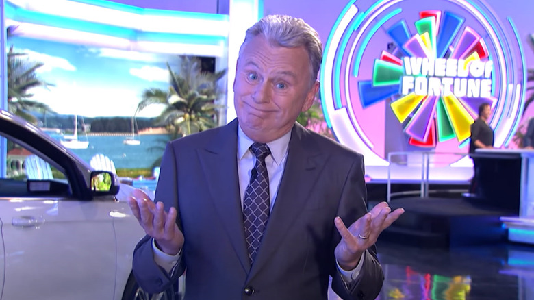 Pat Sajak with palms up