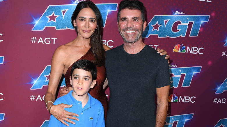 Simon Cowell, Lauren Silverman, and Eric posing