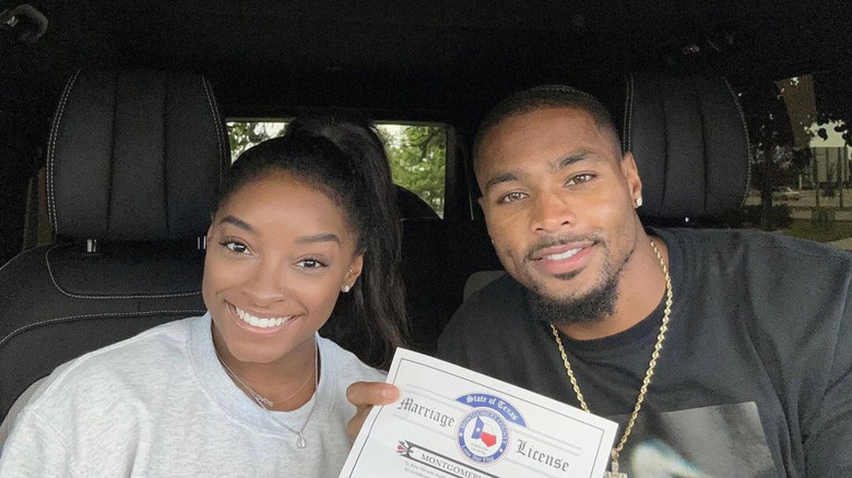 Simone Biles and Jonathan Owens smile 