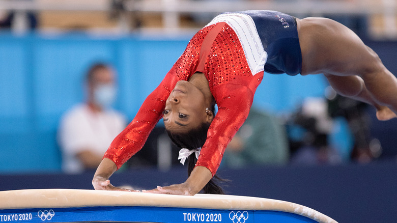 Simone Biles performs at the Olympics