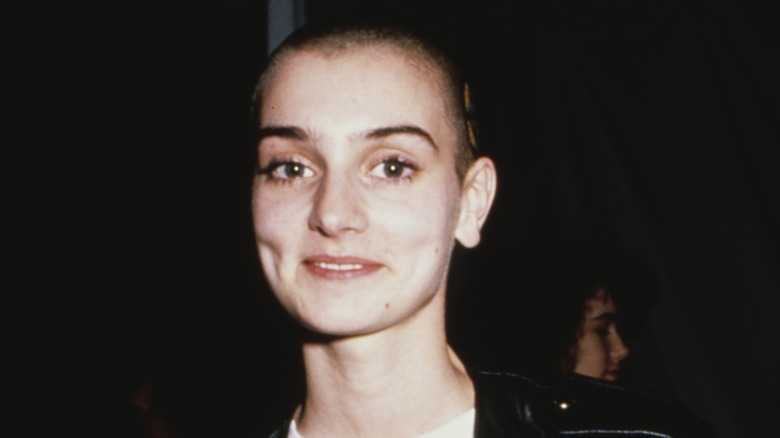 Sinead O'Connor shaved head smiling