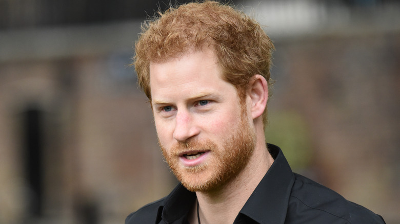 Prince Harry with a neutral expression