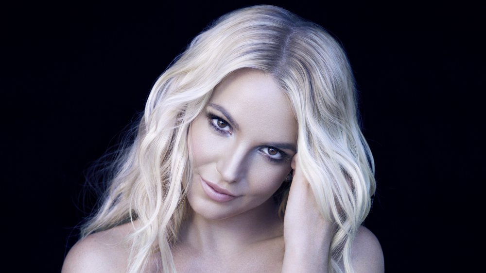 Britney Spears smirking while tilting her head