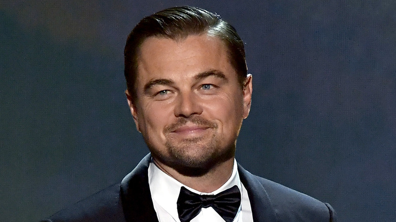 Leonardo DiCaprio smiling on stage