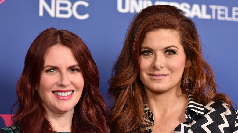 Debra Messing and Megan Mullally pose 