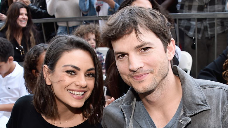 Mila Kunis and Ashton Kutcher smile