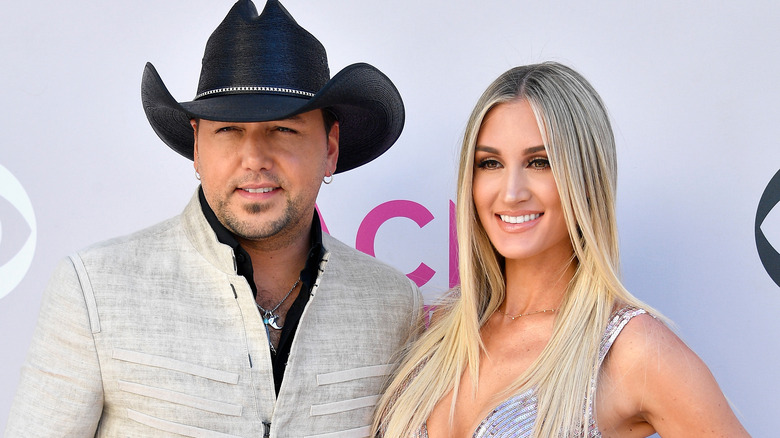 Jason Aldean posing with Brittany Kerr