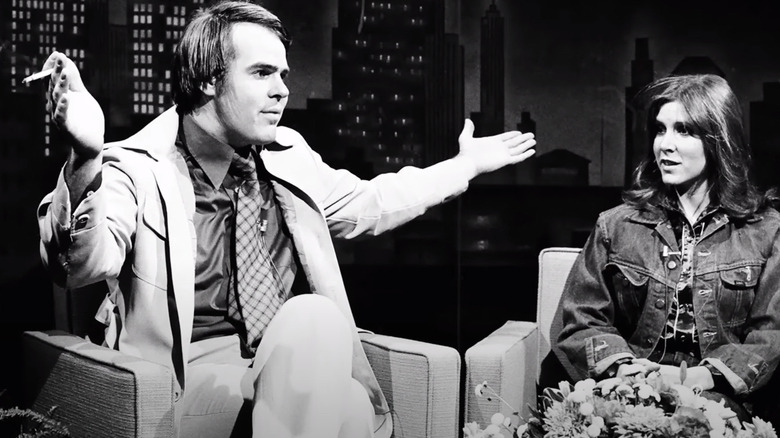 Dan Aykroyd amd Carrie Fisher sitting