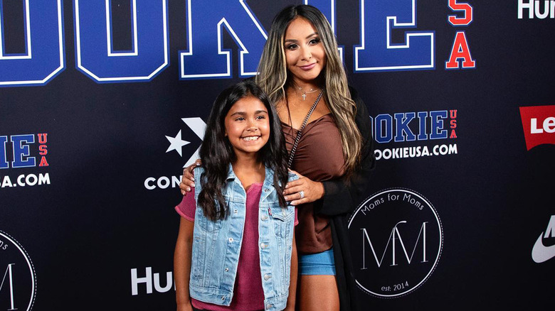 Snooki posing with daughter Giovanna