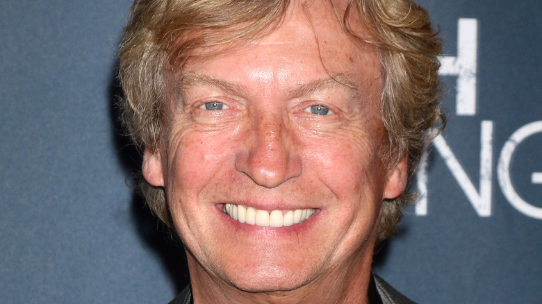 Nigel Lythgoe smiling on red carpet