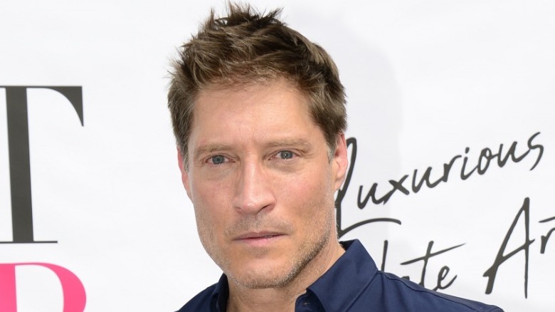 Sean Kanan posing at event