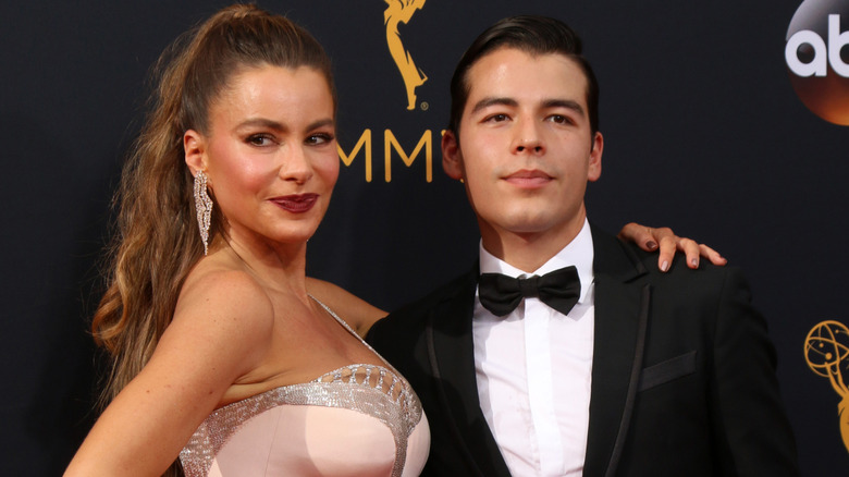 Sofia and Manolo Vergara posing together on the Emmys red carpet