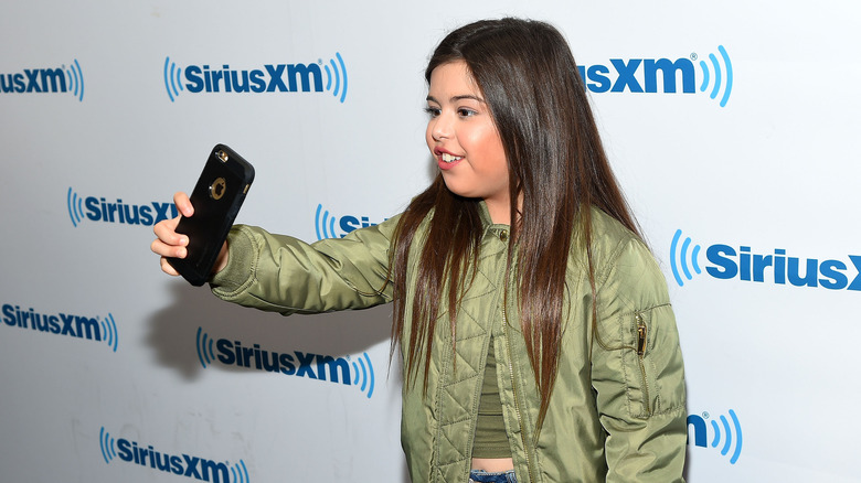 Sophia Grace Brownlee taking a selfie at an event