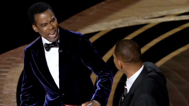 Chris Rock and Will Smith appear on stage 