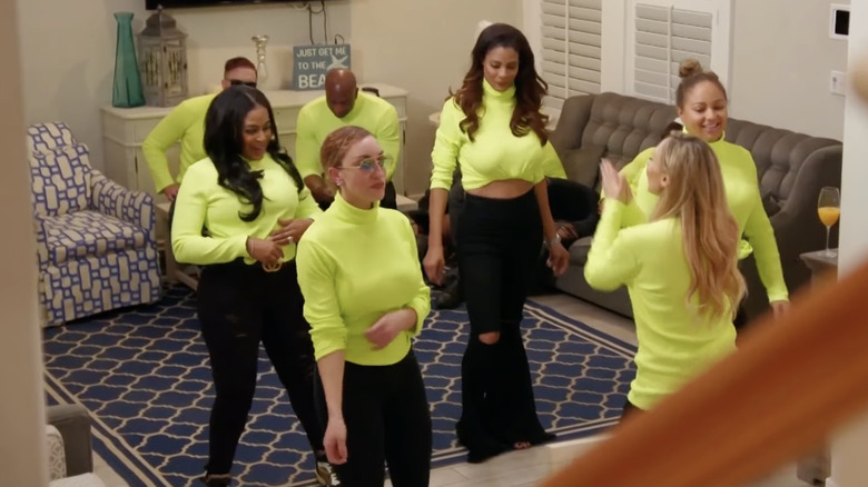 The cast of Southern Charm New Orleans in green turtlenecks