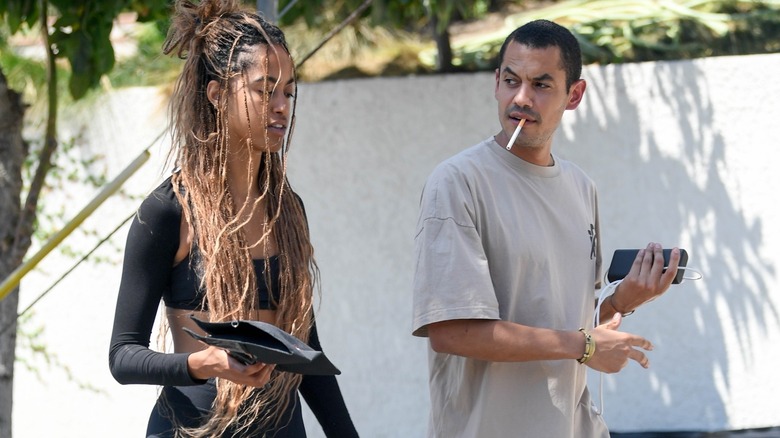 Malia Obama walks next to unknown young man on 7/29