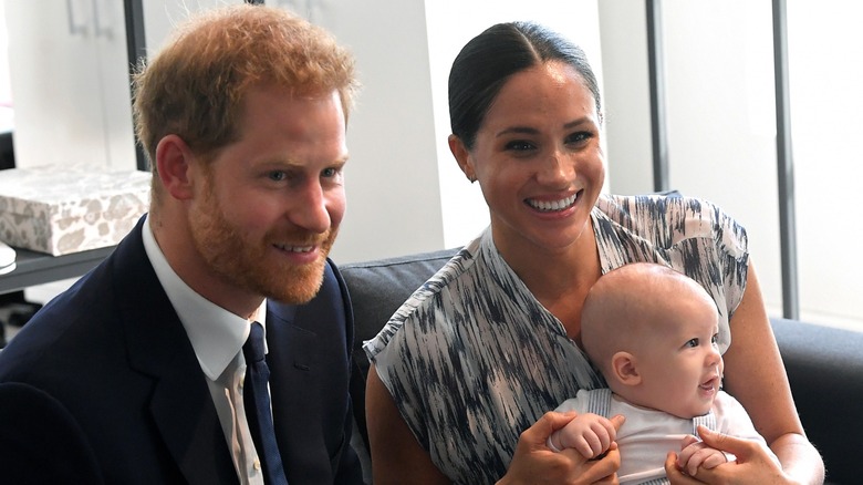 Meghan Markle, Prince Harry, and baby Archie smiling