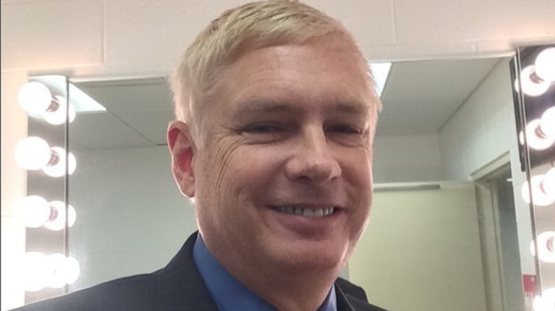 Dave Lamont wearing a blue shirt, smiling