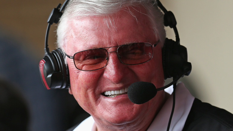 Ken "Hawk" Harrelson wearing a headset, smiling