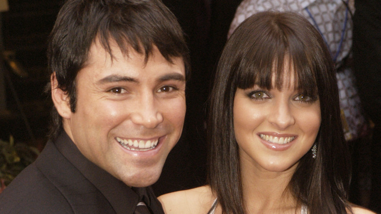 Oscar De La Hoya and Millie Corretjer smiling