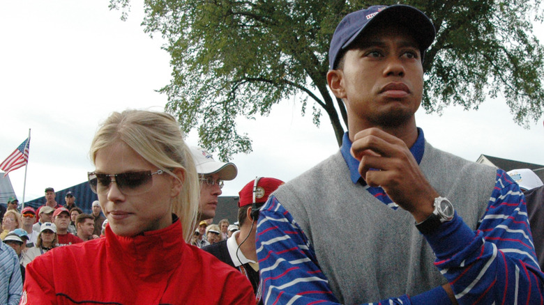 Elin Nordegren and Tiger Woods arms crossed