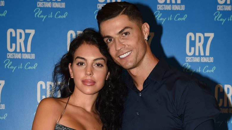 Georgina Rodriguez posing with Cristiano Ronaldo