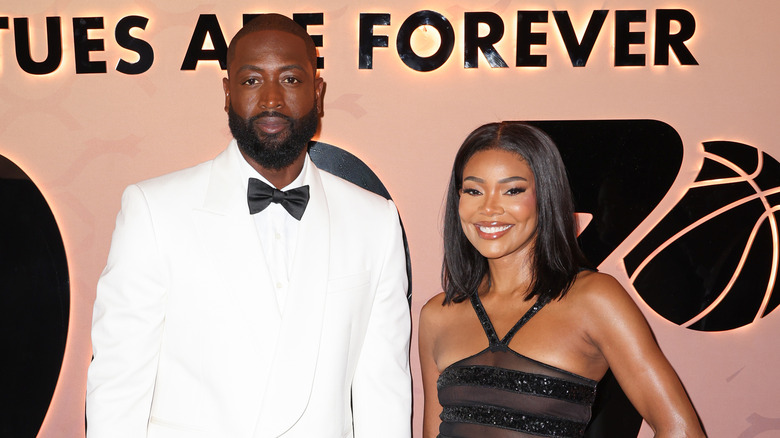 Dwyane Wade and Gabrielle Union smile on the red carpet