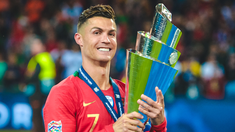 Cristiano Ronaldo holding trophy