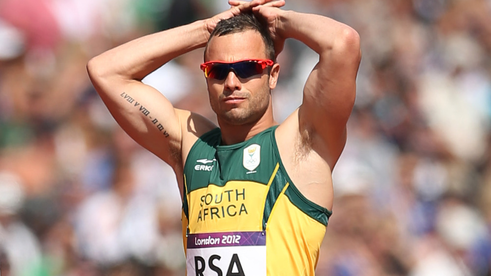 Oscar Pistorius resting his hands on his head