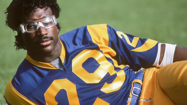 Eric Dickerson relaxing on the field