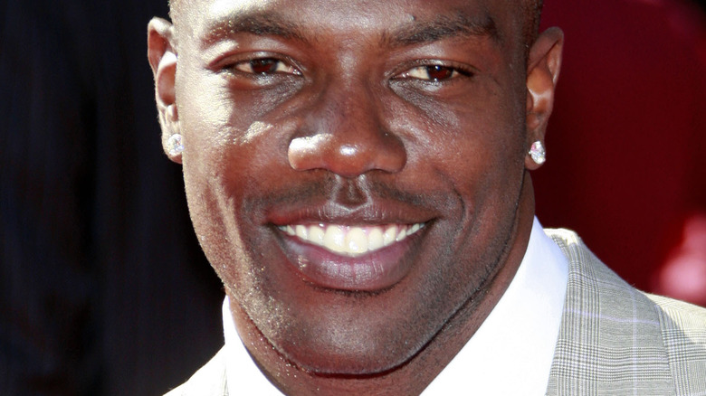 Terrell Owens wearing diamond earrings