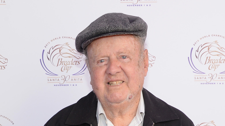 Dick Van Patten poses on the red carpet